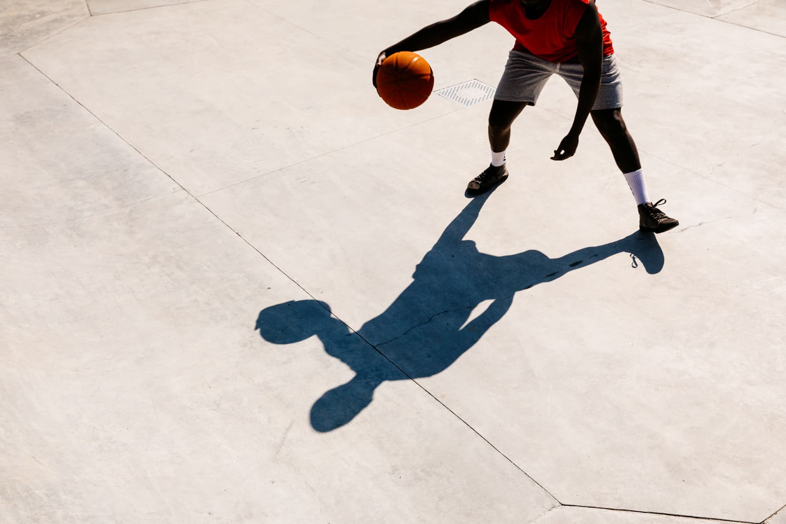 A basketball player and his shadow