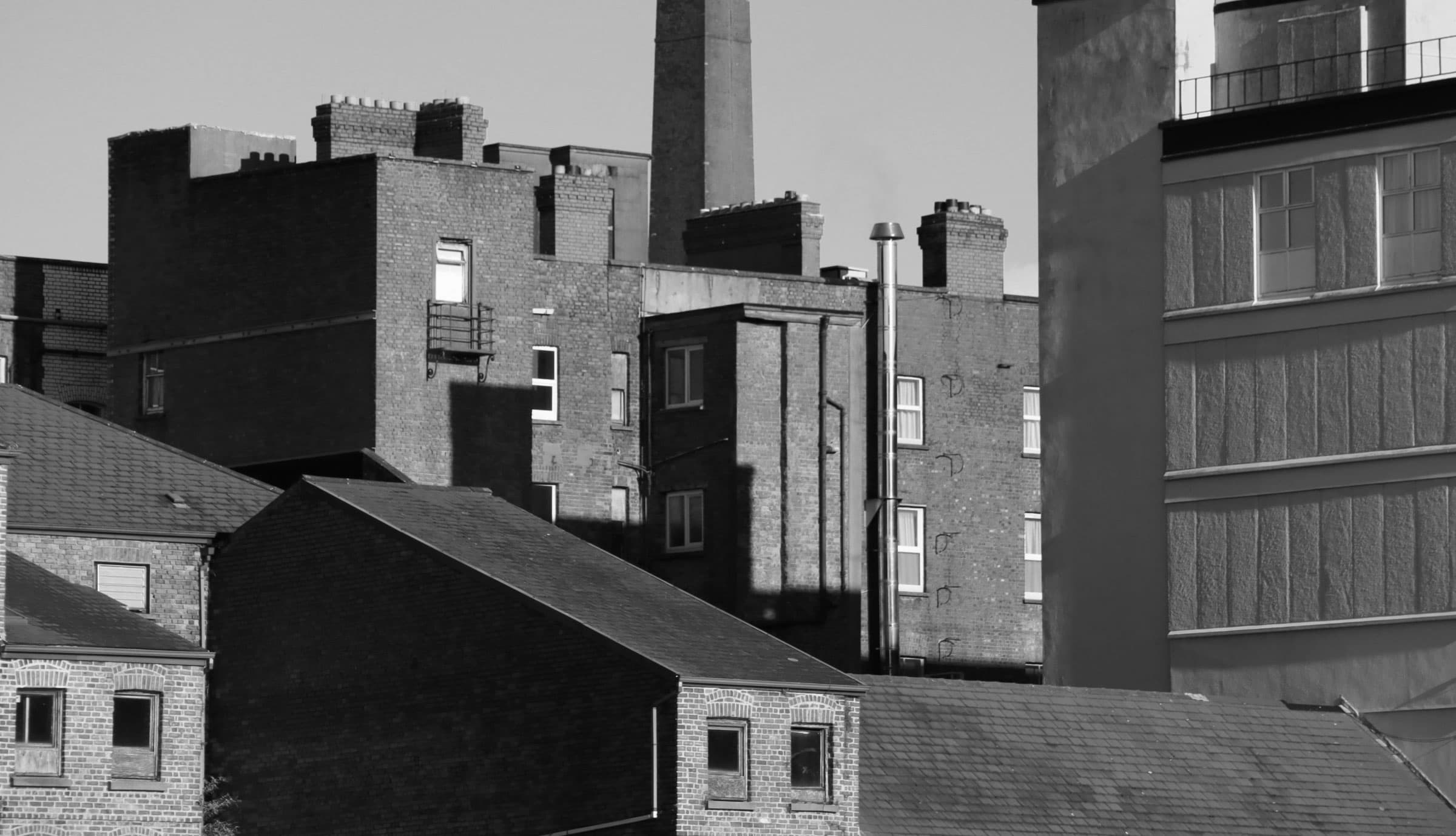 Low angle view of industrial buildings against the sky.