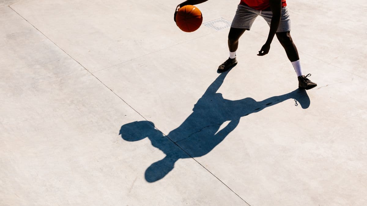 A basketball player and his shadow
