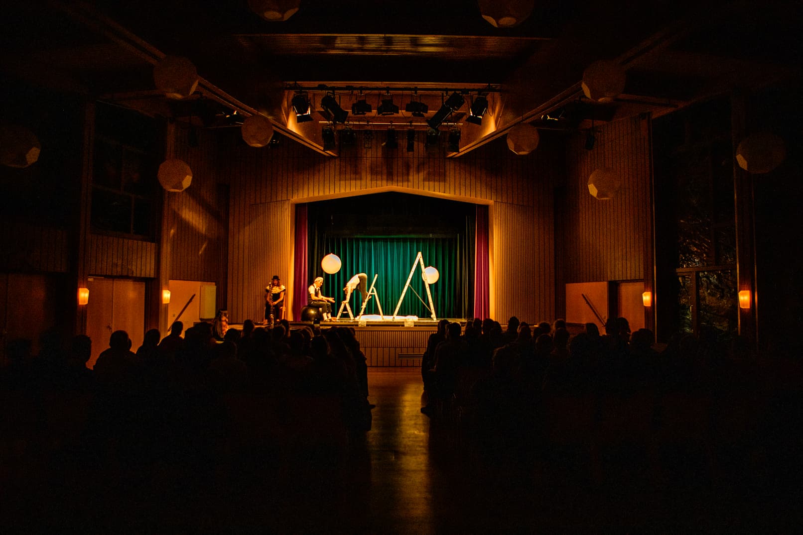 Small group of actors on stage during their performance